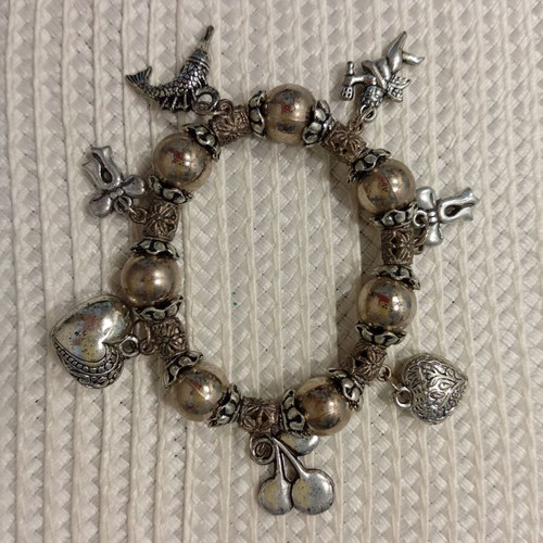 Bracelet with decorative charms like new, antique silver color