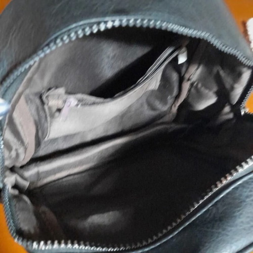 Backpack black medium made of eco leather with silver zippers like new