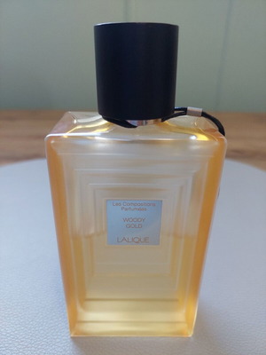 Lalique Woody Gold Eau de Parfum 100ml, half full