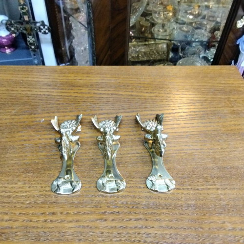 Set of brass reindeer door handles in golden tone like new, 3 pieces