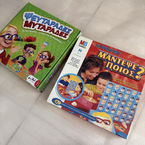 Set of 2 board games: Guess Who (Hasbro) + Pseftarades Mytarades (AS)