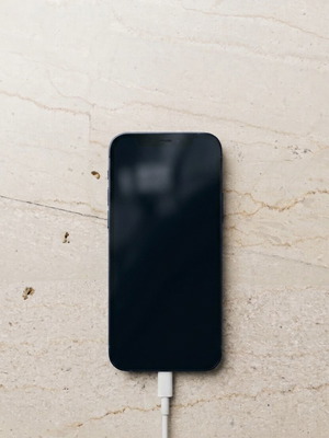 I phone 12 64GB blue like new with charger and 7 cases