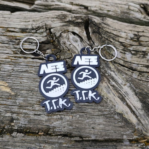 Set of 2 Lex T.G.K. keychains new with embossed design