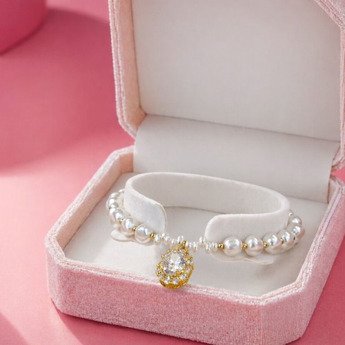 Bracelet with pearls and rhinestones made of steel new with box