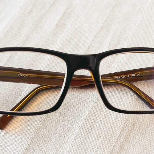 Touch eyeglasses like new, brown frame with gold interior