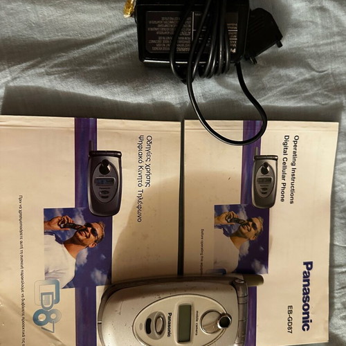 Panasonic EB-GD87 mobile phone used with box and charger needing repair