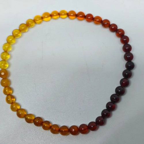 Handmade bracelet from natural amber with color gradient like new