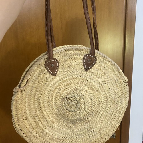 Round woven straw shoulder bag with leather handles