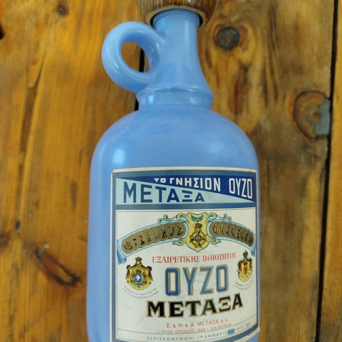 Metaxa ouzo bottle collectible like new, porcelain with wooden stopper
