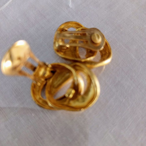 Clip-on earrings used, relief design, bronze tone