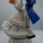 Vintage porcelain music figurine of dancing couple, like new
