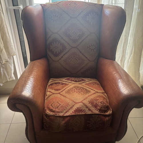 Kourtis armchair used with leather arms in brown tones