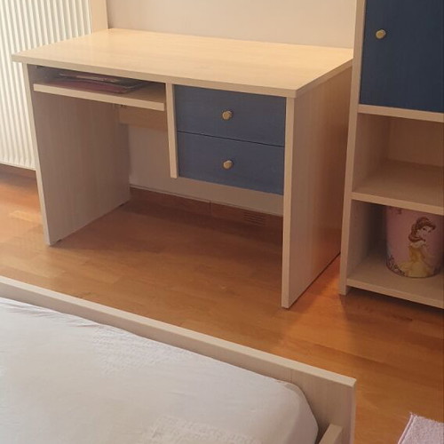 Blue bedroom set with desk, bookshelves and bed