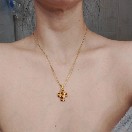 Necklace with gold color cross pendant and red rhinestones like new