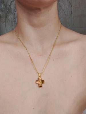 Necklace with gold color cross pendant and red rhinestones like new