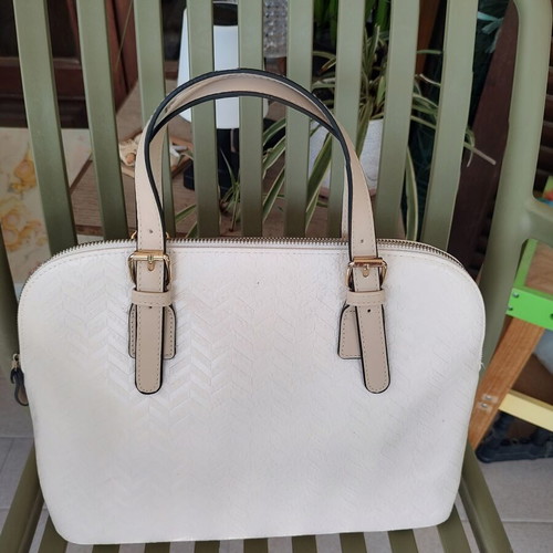 Elegant off-white women's handbag with gold details