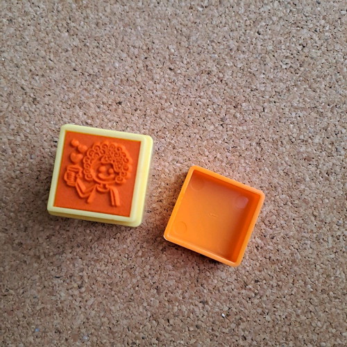 Labyrinth stamp like new, small orange with toy