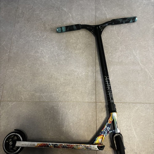 Scouter Envy scooter used with new handles, wheels, and grip tape