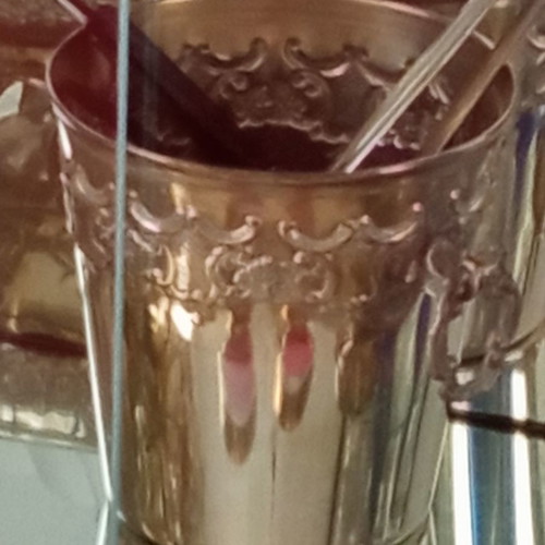 Silver-plated vintage ice bucket used with tongs