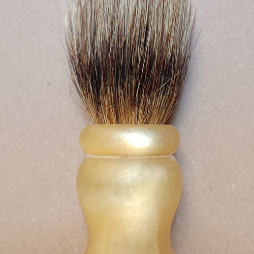 Two shaving brushes, one says it is made in West Germany.