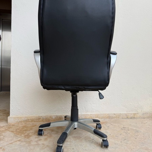 Office chair used with worn covers