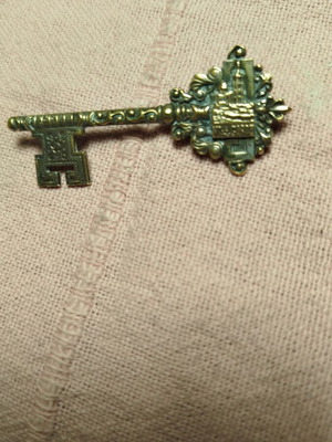 Vintage key brooch used, depicting N.D de la Garde
