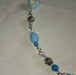 Handmade blue necklace with metal frame and beads