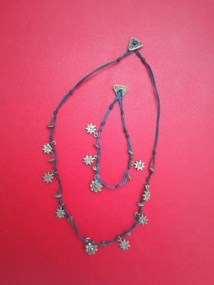 Boho style necklace and bracelet set used with blue cord and silver pendants