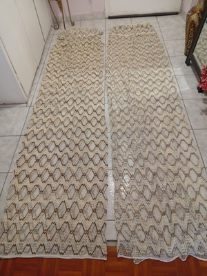 Pair of beige and brown curtains with ruffles, heavy knit