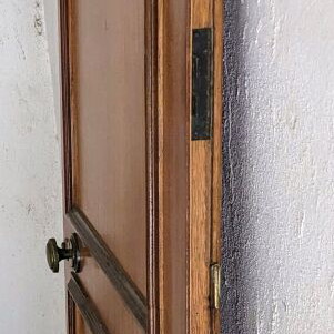Wooden door used with double lock and peephole