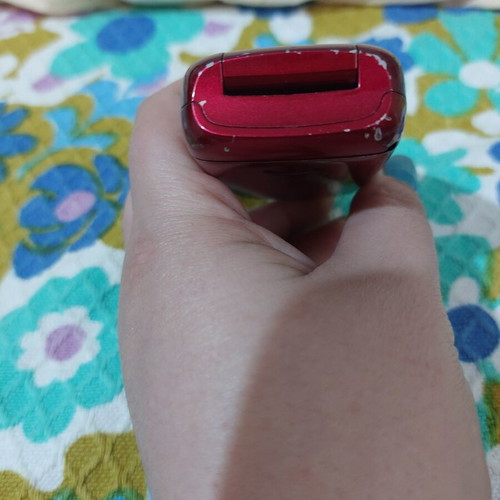 Alcatel vintage flip phone used, red, charger included