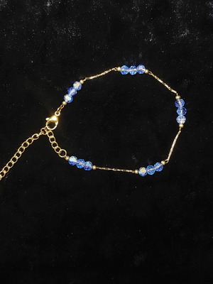 Stainless steel bracelet new, golden with light blue beads