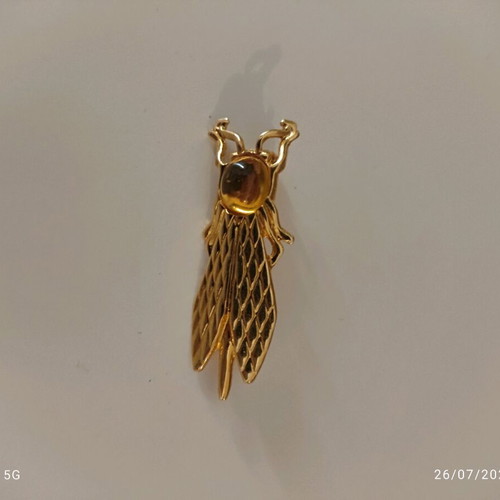 Yves Rocher gold plated brooch like new, cicada design with cabochon stone