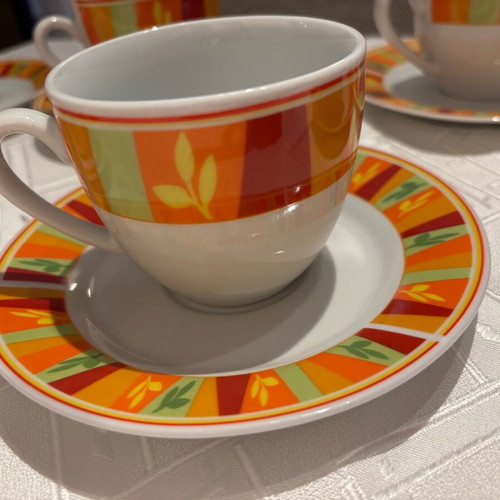 Vintage set of 6 cups and 6 saucers with bright colors, unused