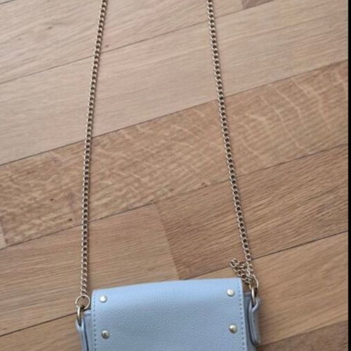 Small blue crossbody bag with chain and studs