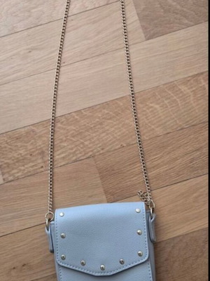 Small blue crossbody bag with chain and studs