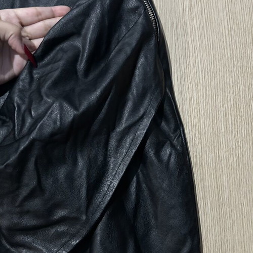 Leather mini skirt with ruching on one back side small used, black