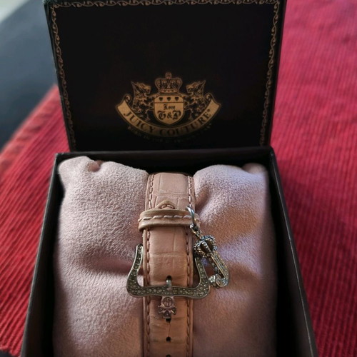 Juicy Couture wristwatch used with Swarovski stones