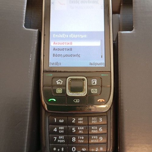 Nokia E66 retro slider phone used with original accessories