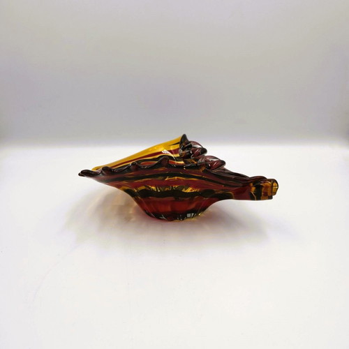 Glass ashtray used red with shell design
