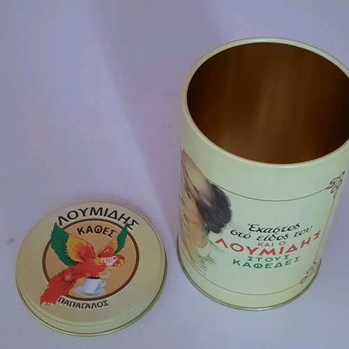 Collectible metal cylindrical Loumidis parrot tin new