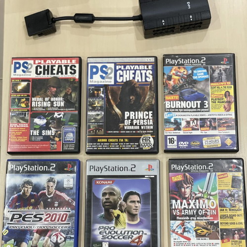 PlayStation 2 console with controller, multi tap and cables