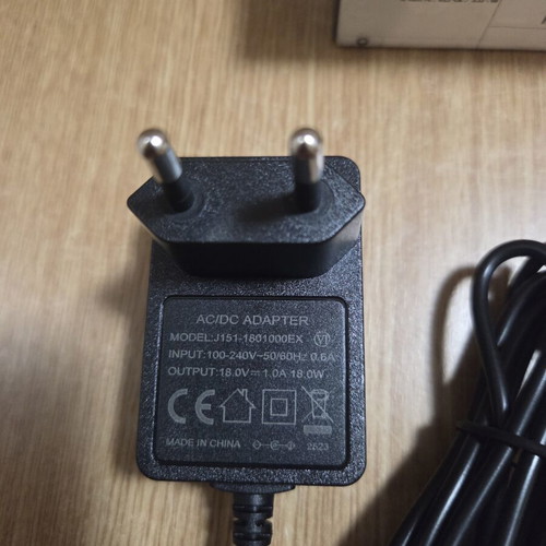 Power adapter model J151-1801000EX 18.0V 1.0A new
