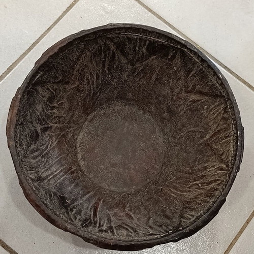 Antique wooden bowl with leather used