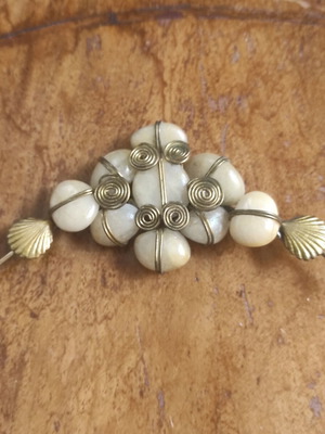 Vintage brooch or clothing belt accessory with semi-precious stones used