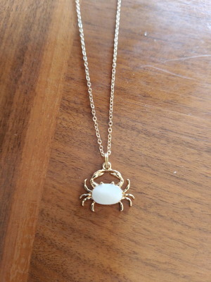 Crab necklace with white enamel new, gold color