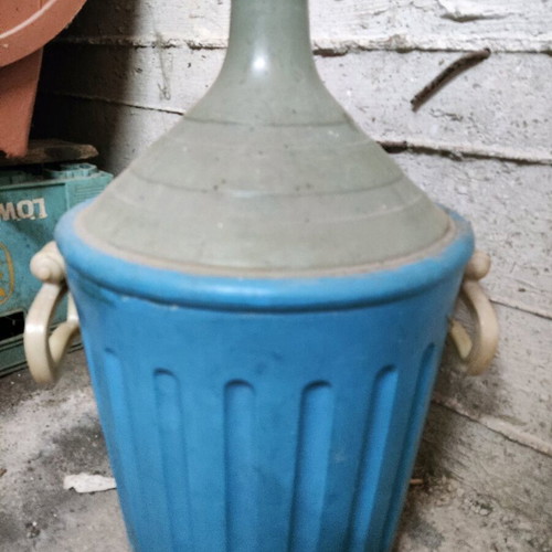 Large glass demijohn with plastic casing like new