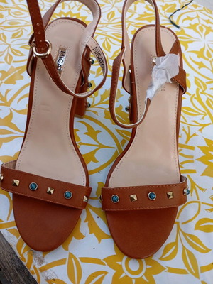 Migato tan sandals new with studs on strap and heel size 37