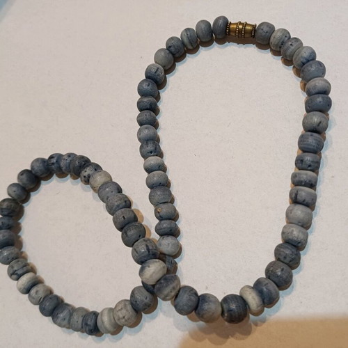 Necklace used with porous blue-gray stones from Thailand