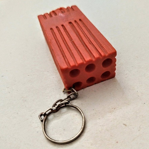 Happy Brick keychain like new, soft and lightweight